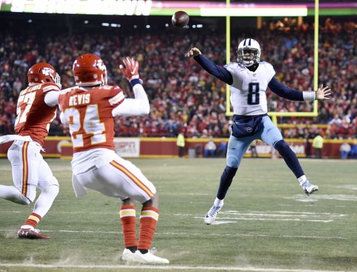 Tennessee Titans quarterback Marcus Mariota (8) throws a pass that was deflected by Kansas City but was ultimately caught by Mariota for a touchdown during the AFC Wild Card game. Andrew Nelles / Tennessean.com / USA TODAY NETWORK